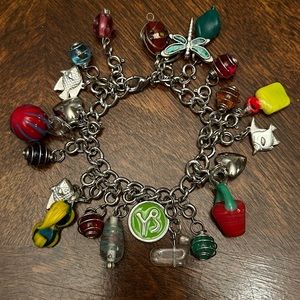 Very unique charm bracelet, with metal and glass bead accents.